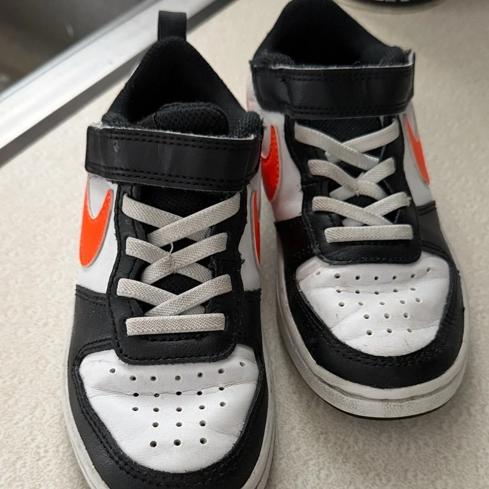 Nike Kids' Sneakers in Black, White, and Orange